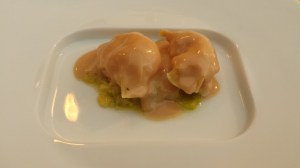 Langoustine ravioli with goose liver sauce and green cabbage