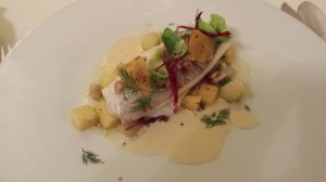 Steamed fillet of plaice with quinces, lemons and walnuts, Crémant Sauce and polenta crisps