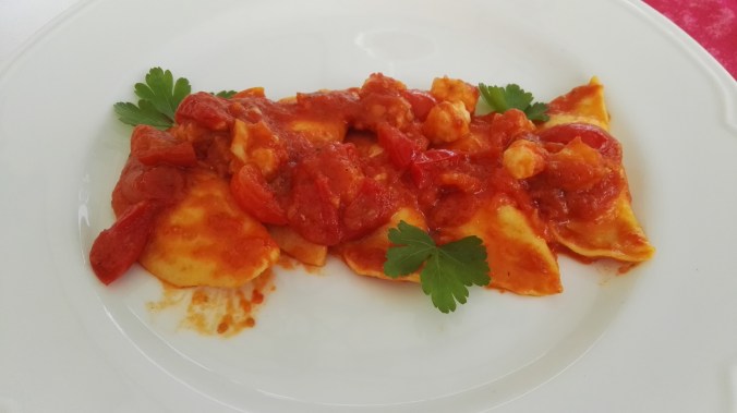 Ravioli filled with scallops and a shrimp sauce